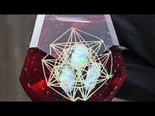 Load and play video in Gallery viewer, red glass geometrical pattern faceted pendant