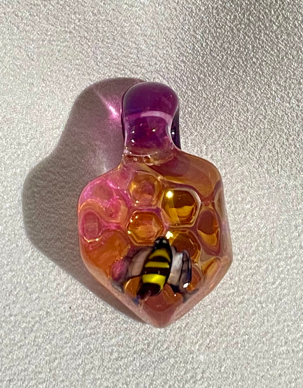 glass bee with golden honeycomb pendant