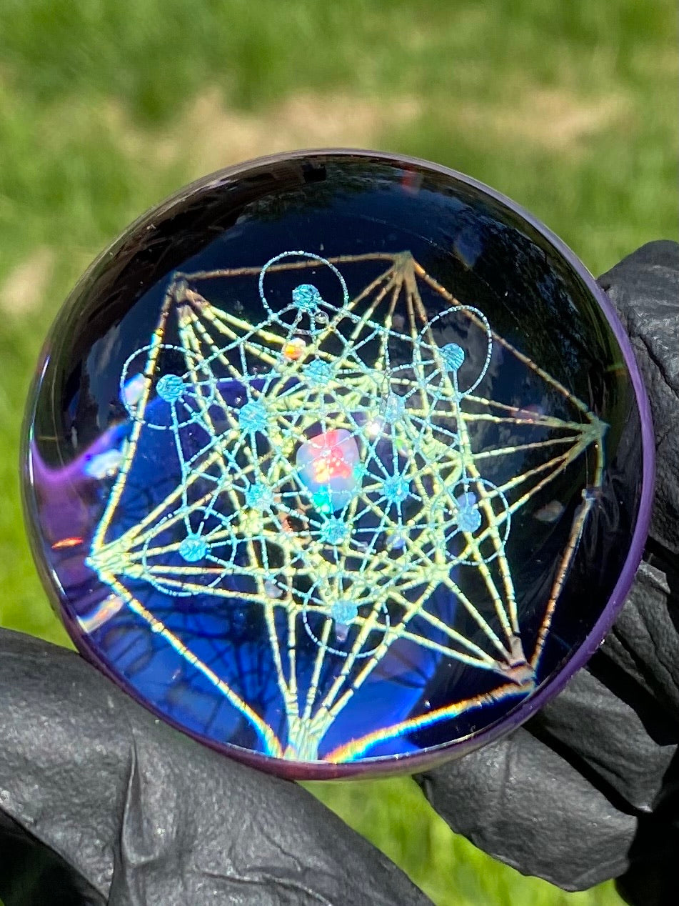 sparkly geometrical art in a sphere with opals